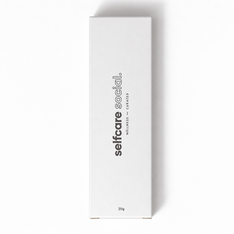 A tall, narrow white rectangular box with black vertical text reading 'selfcare social.' and smaller text 'WILMIES - CUSHIONED' plus '20g' near the bottom, photographed on a white background with a soft shadow.